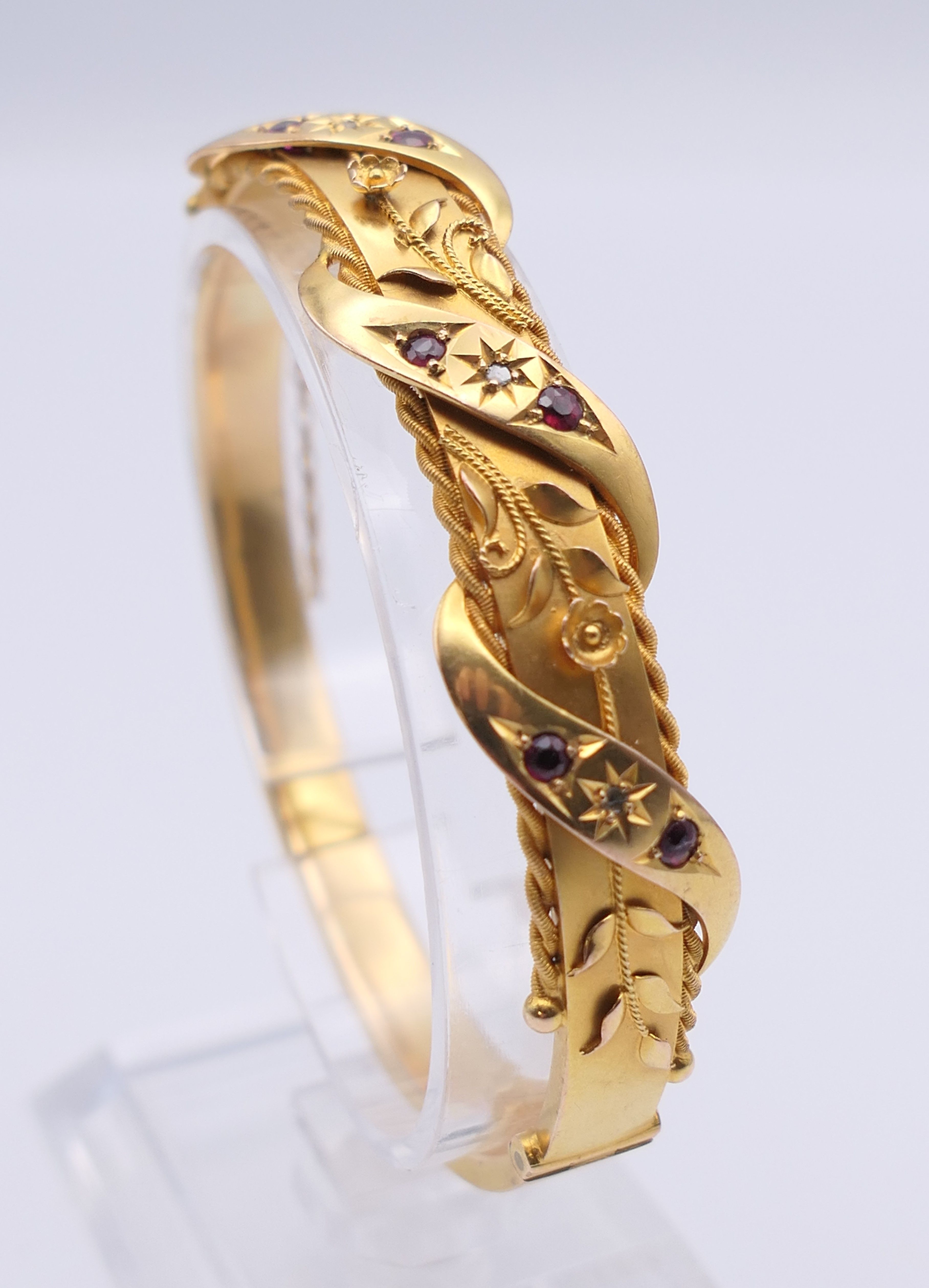 A 9 ct gold diamond and ruby bangle form bracelet. 6 cm internal diameter. 11. - Image 3 of 10