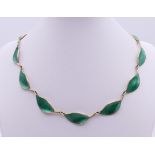 A David Andersen green enamel and silver leaf form necklace. 40 cm long.
