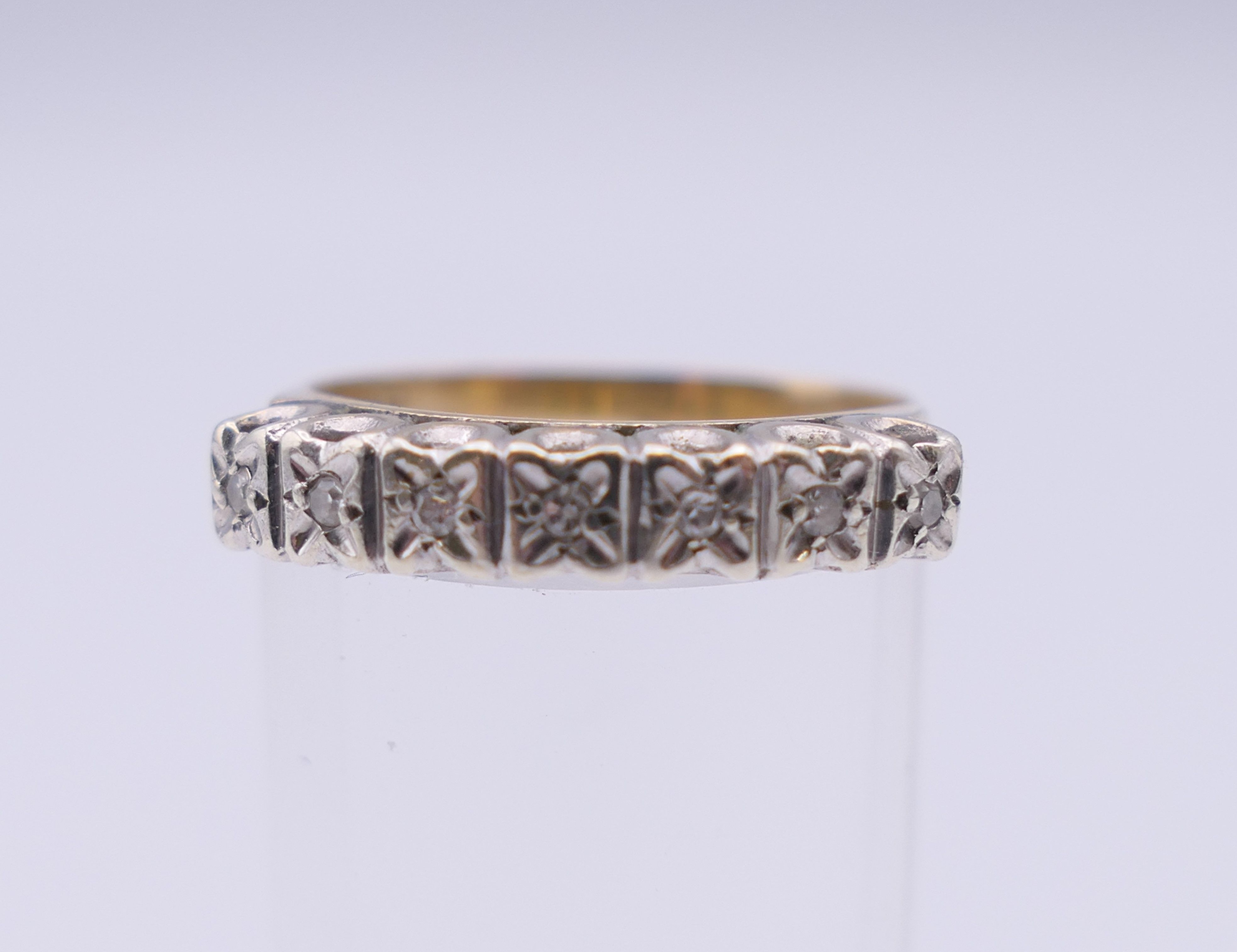 A 9 ct gold seven stone diamond ring. Ring size N/O. 2.5 grammes total weight. - Image 2 of 8