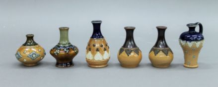 Six miniature Doulton vases. The largest 7.5 cm high.