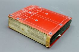 A vintage postcard album.