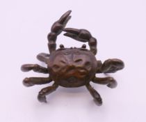 A bronze model of a crab. 6 cm wide.