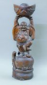 A Chinese carved wooden model of Buddha. 69 cm high.
