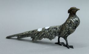 A vintage silver plated model of a pheasant with glass eyes. 27 cms long.