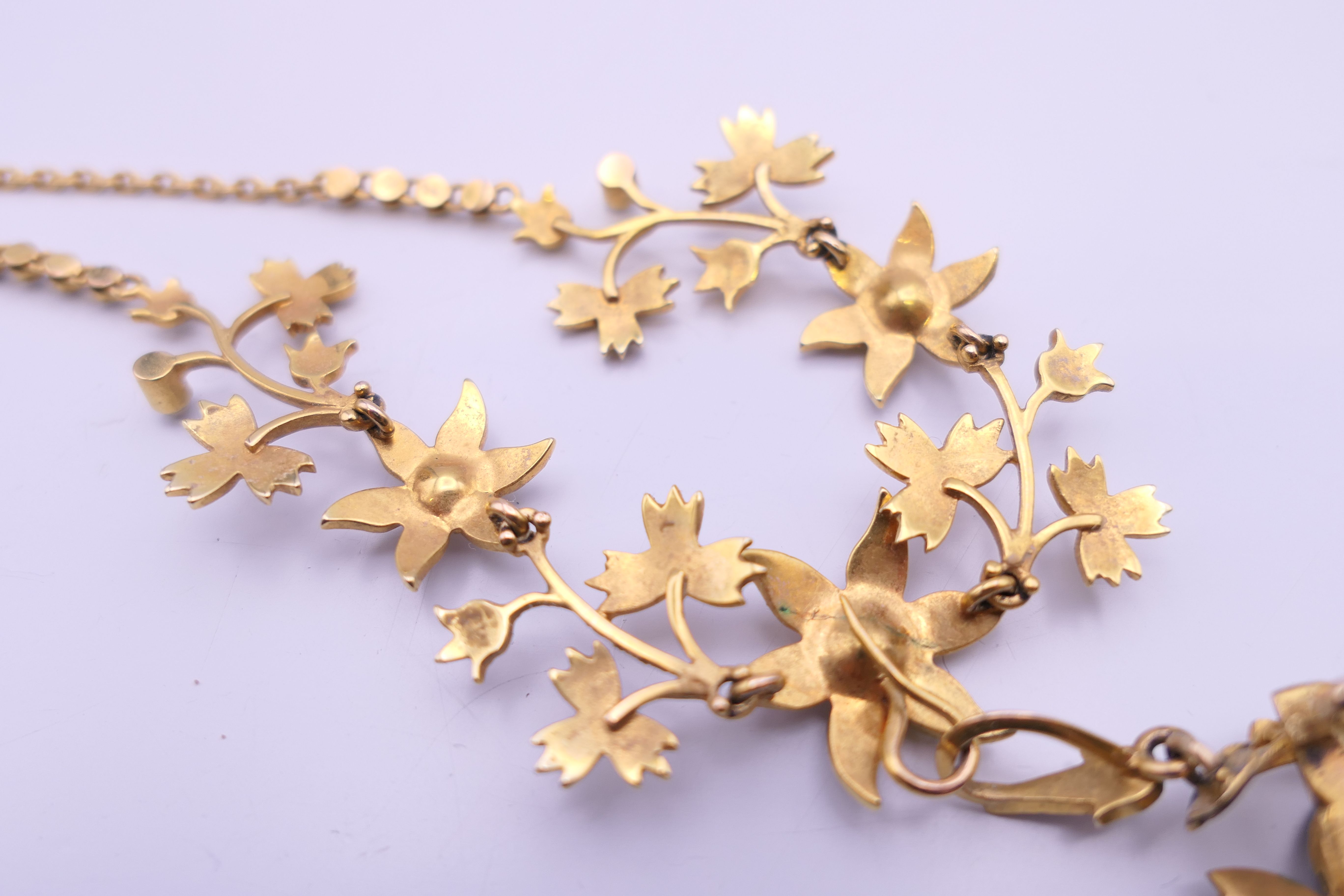 An unmarked gold seed pearl set necklace of scrolling floral form and detachable pendant formed as - Image 16 of 16