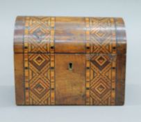 A Victorian inlaid walnut tea caddy. 17.5 cm wide.