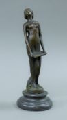 An Art Nouveau style bronze model of a singing girl on a plinth base. 18.5 cm high.