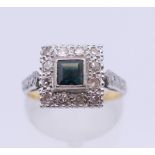 An Art Deco style 18 ct gold diamond and sapphire ring. Ring size M. 4.6 grammes total weight.