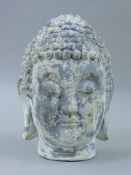 A rustic Buddha head. 33 cm high.