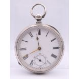 A Waltham silver open face pocket watch. 5 cm diameter.