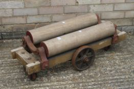 A vintage trolley with two wooden rollers. 89 cm long.