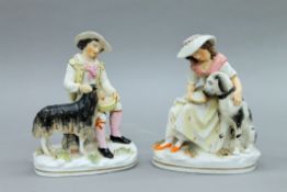 Two 19th century Staffordshire pottery figures formed as a shepherd and shepherdess.