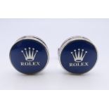 A pair of cufflinks stamped Rolex. 1.5 cm diameter.