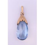 A 9 ct gold mounted topaz pendant. 3 cm high excluding suspension loop.
