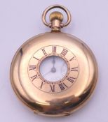 A Waltham gold plated half hunter pocket watch. 4.5 cm diameter.