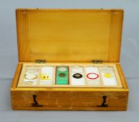 A quantity of microscope slides housed in a box.