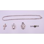 Two silver fobs, a silver necklace, a silver cross and a silver shamrock bar brooch.