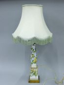 An early 20th century Samson porcelain reticulated and flower encrusted columnar lamp base with