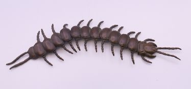 An articulated bronze model of a centipede. 16 cm long.