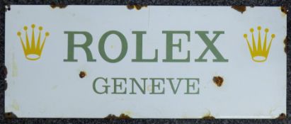 A Rolex enamel sign. 58 x 23 cm.