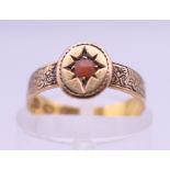 A Victorian 18 ct gold coral set ring. Ring size H/I. 2 grammes total weight.