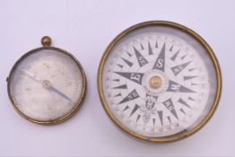 Two Victorian brass compasses, the larger lidded example by H Hughes & Son, 59 Fenchurch St, London.