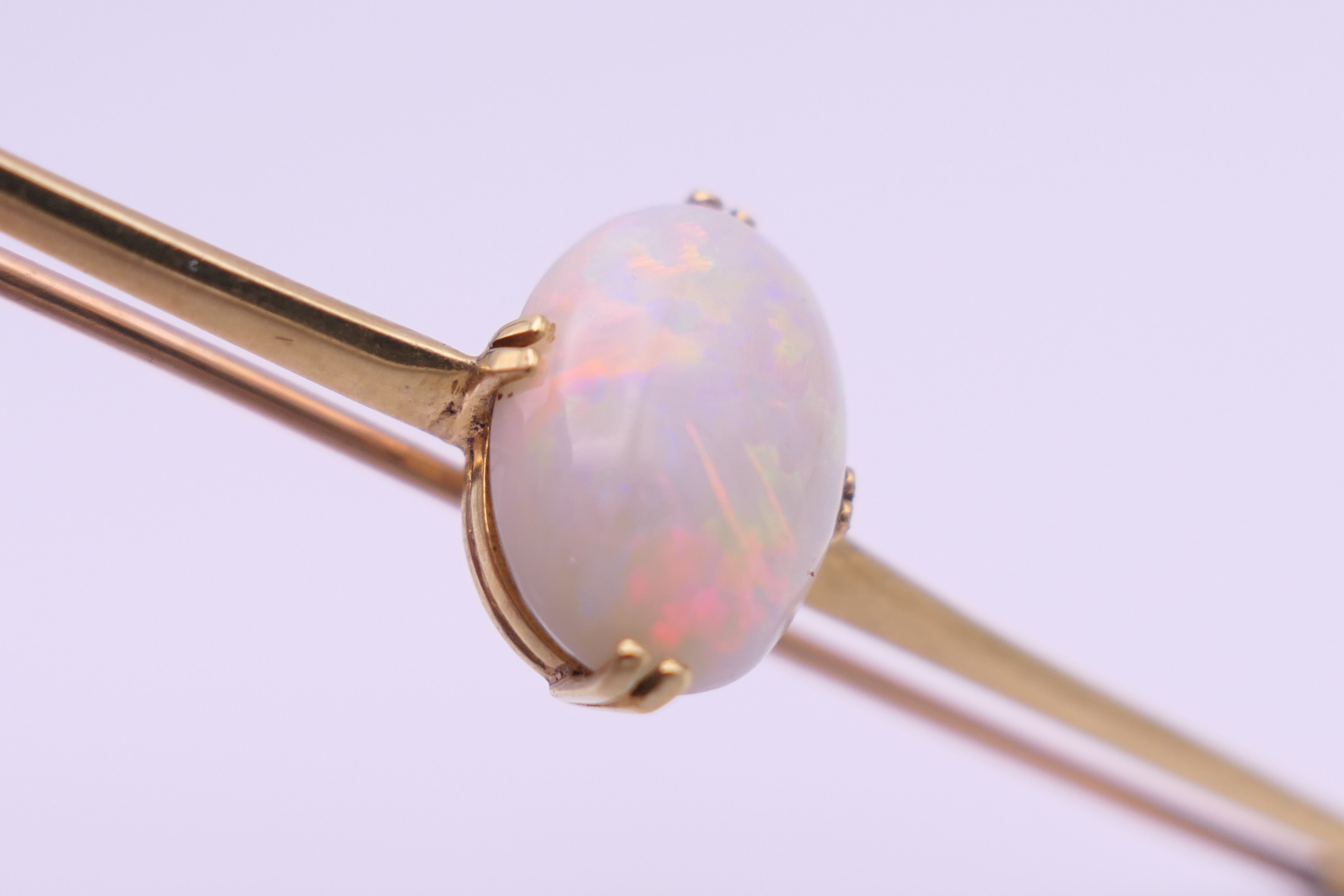 A 15 ct gold opal set bar brooch. 7 cm long, opal 1.5 cm high. 5.3 grammes total weight. - Image 6 of 9