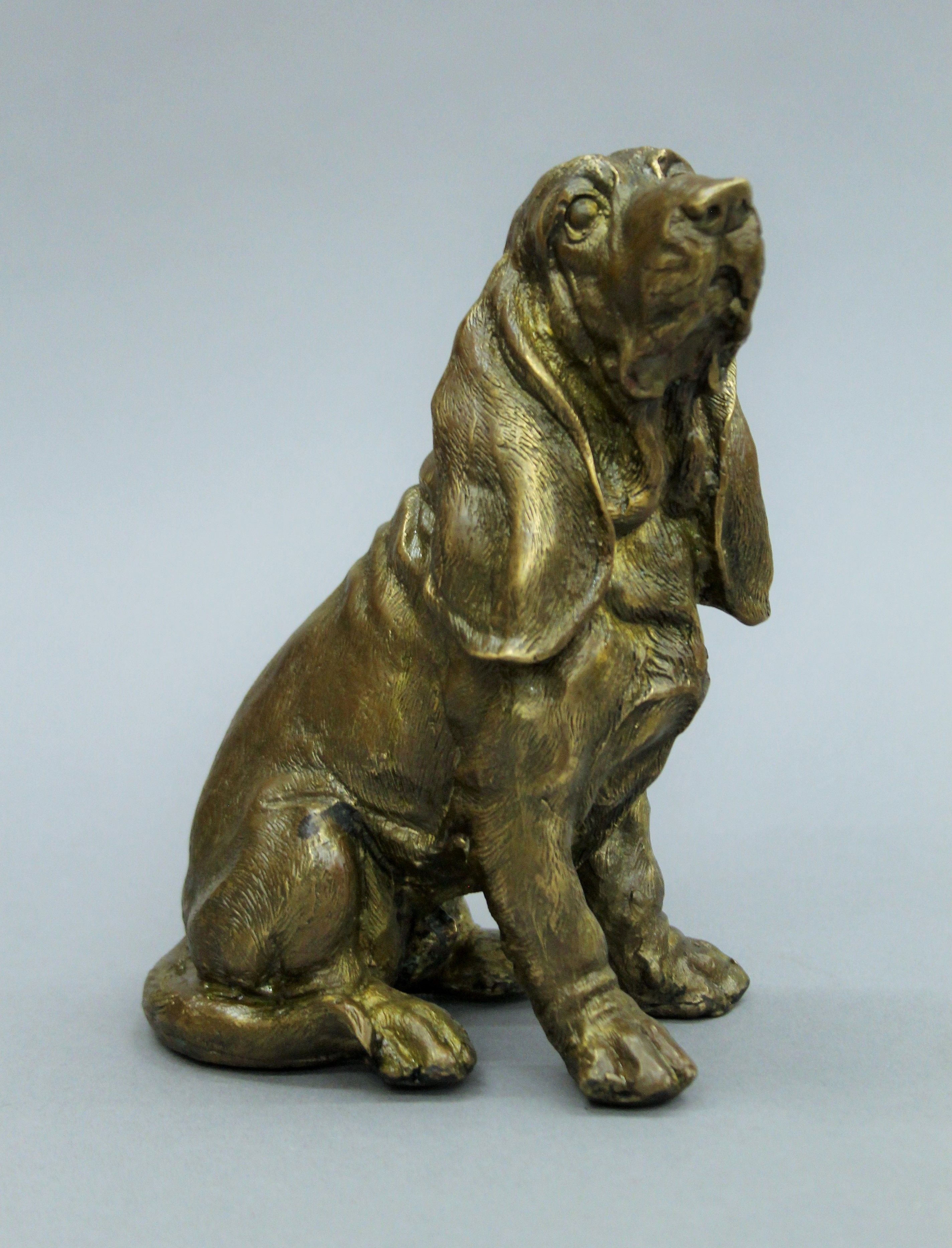 A bronzed figure of a German shepherd, signed Paul Herzel (1876-1956) and two bronze models of dogs. - Image 2 of 5