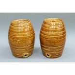 A pair of Victorian pottery spirit barrels. Approximately 33 cm high.
