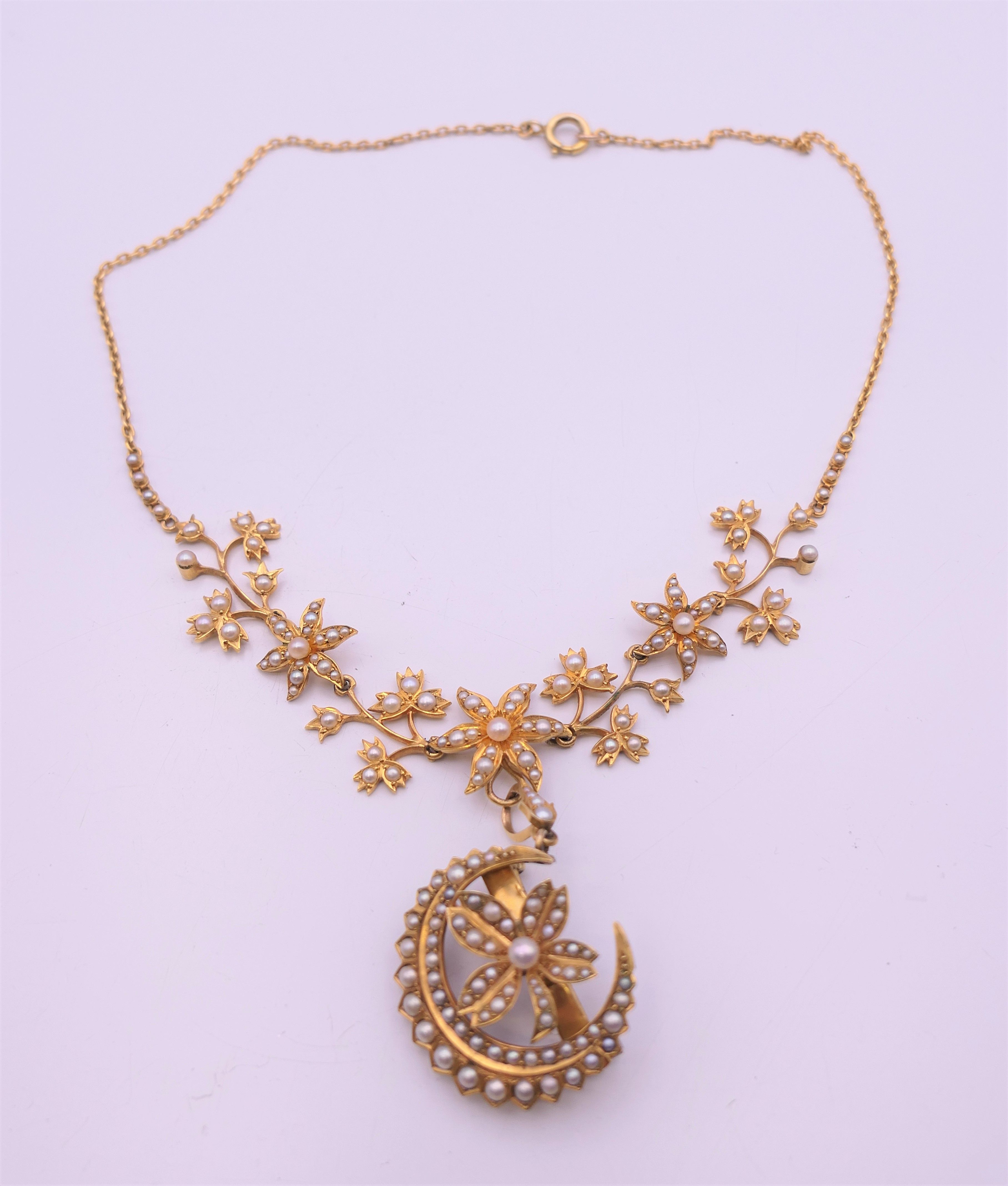 An unmarked gold seed pearl set necklace of scrolling floral form and detachable pendant formed as - Image 7 of 16