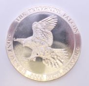 A 1 ounce fine silver peregrine falcon coin.