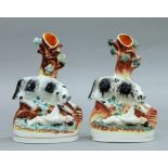 Two 19th century Staffordshire pottery spill vases formed as The Dog that Saved the Downing Girl.