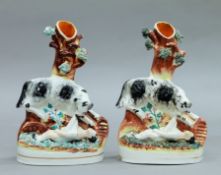 Two 19th century Staffordshire pottery spill vases formed as The Dog that Saved the Downing Girl.