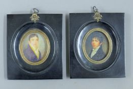 A pair of black framed miniatures. 11 cm wide.