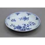An 18th century blue and white porcelain dish. 11.5 cm diameter.