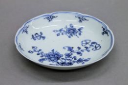 An 18th century blue and white porcelain dish. 11.5 cm diameter.