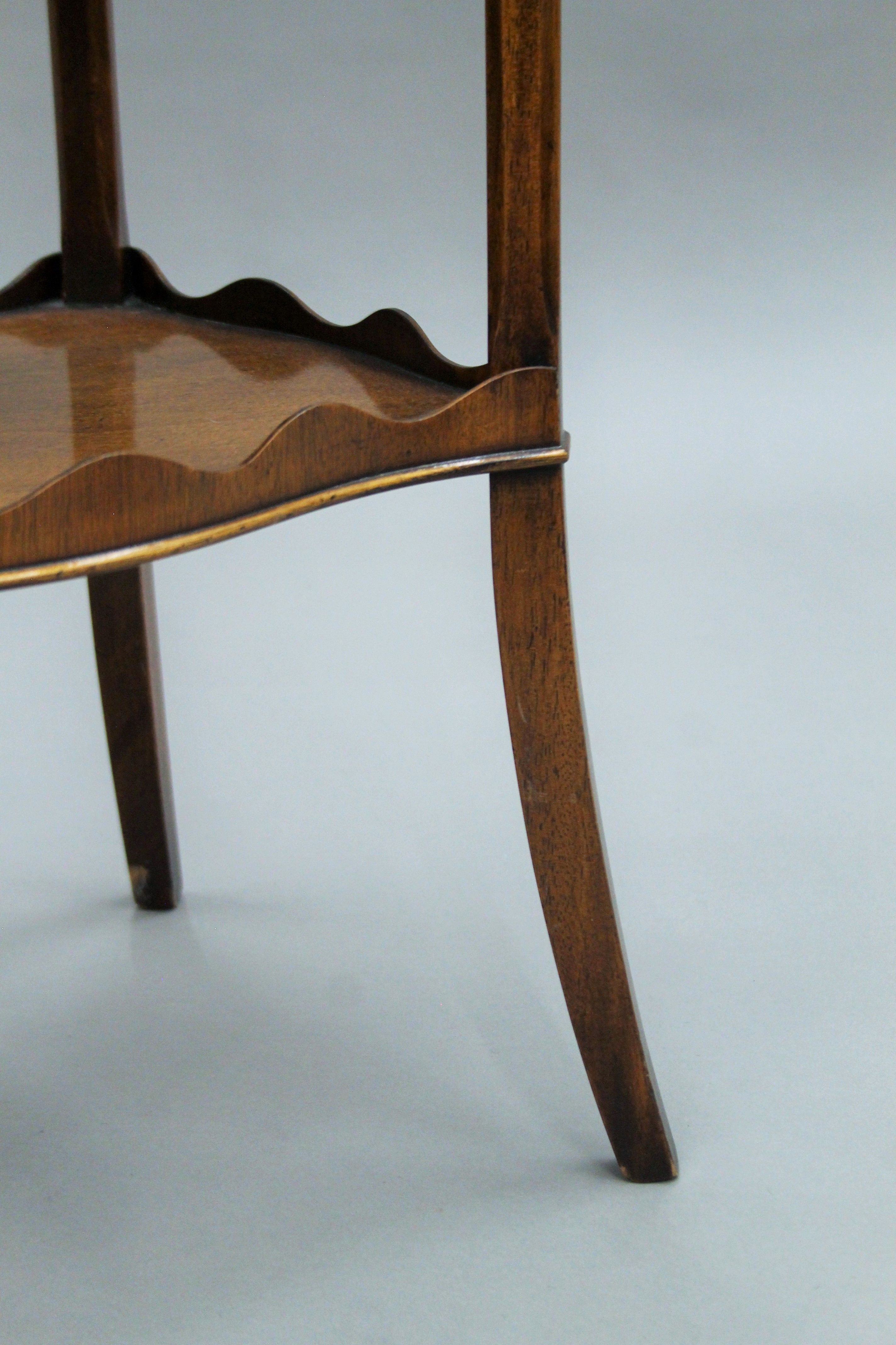 A three-tier mahogany Reprodux side table. 67.5 cm high. - Image 4 of 4