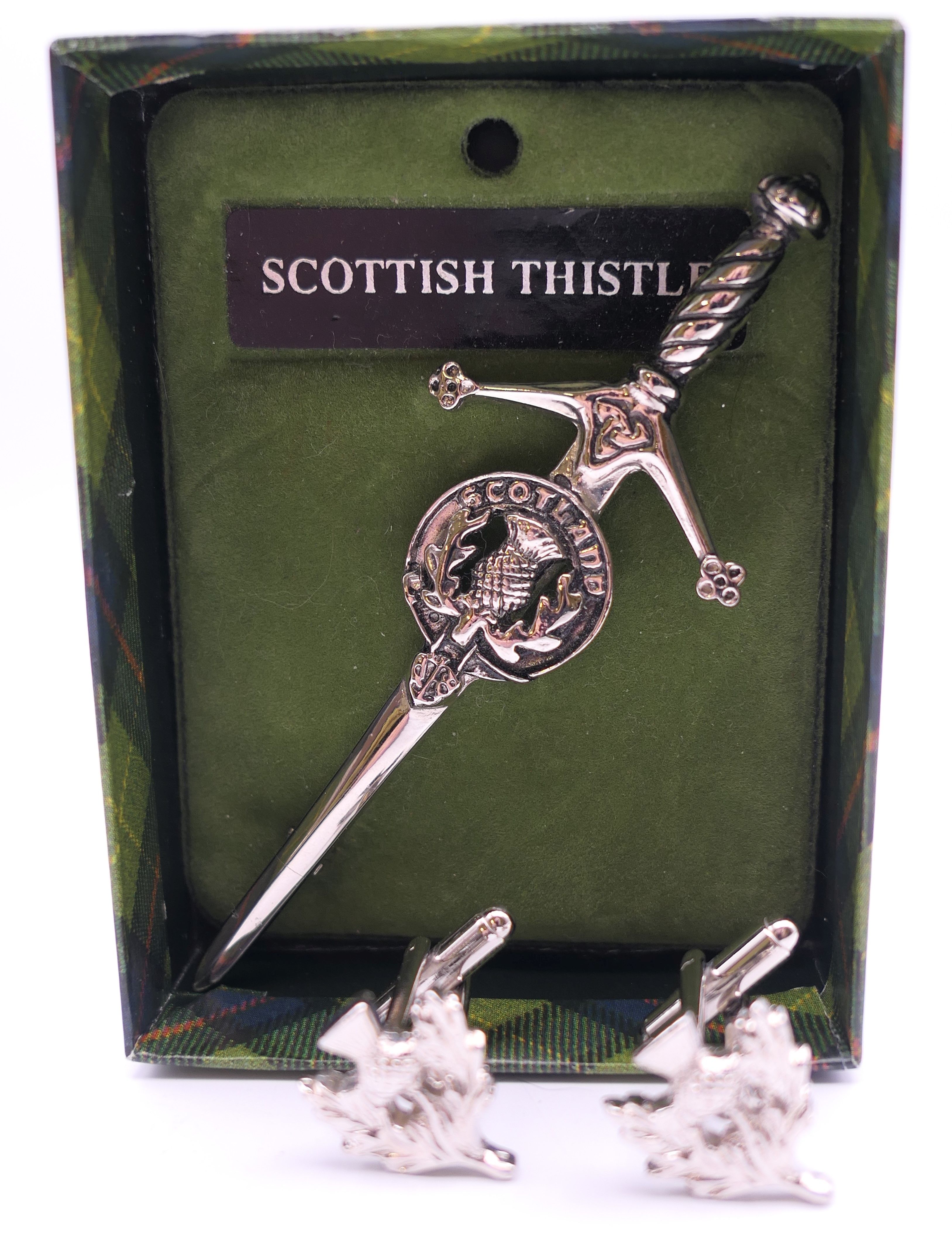 A Scottish Thistle brooch and matching cufflinks. Brooch 9 cm long.