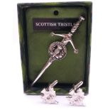 A Scottish Thistle brooch and matching cufflinks. Brooch 9 cm long.