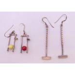 Two pairs of white metal/silver handmade commissioned croquet earrings. The mallets 4 cm high.