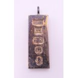 A silver ingot pendant. 4 x 1.5 cm. 29.7 grammes.