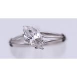 An Art Deco unmarked platinum and diamond ring. Ring size L. 2 grammes total weight.