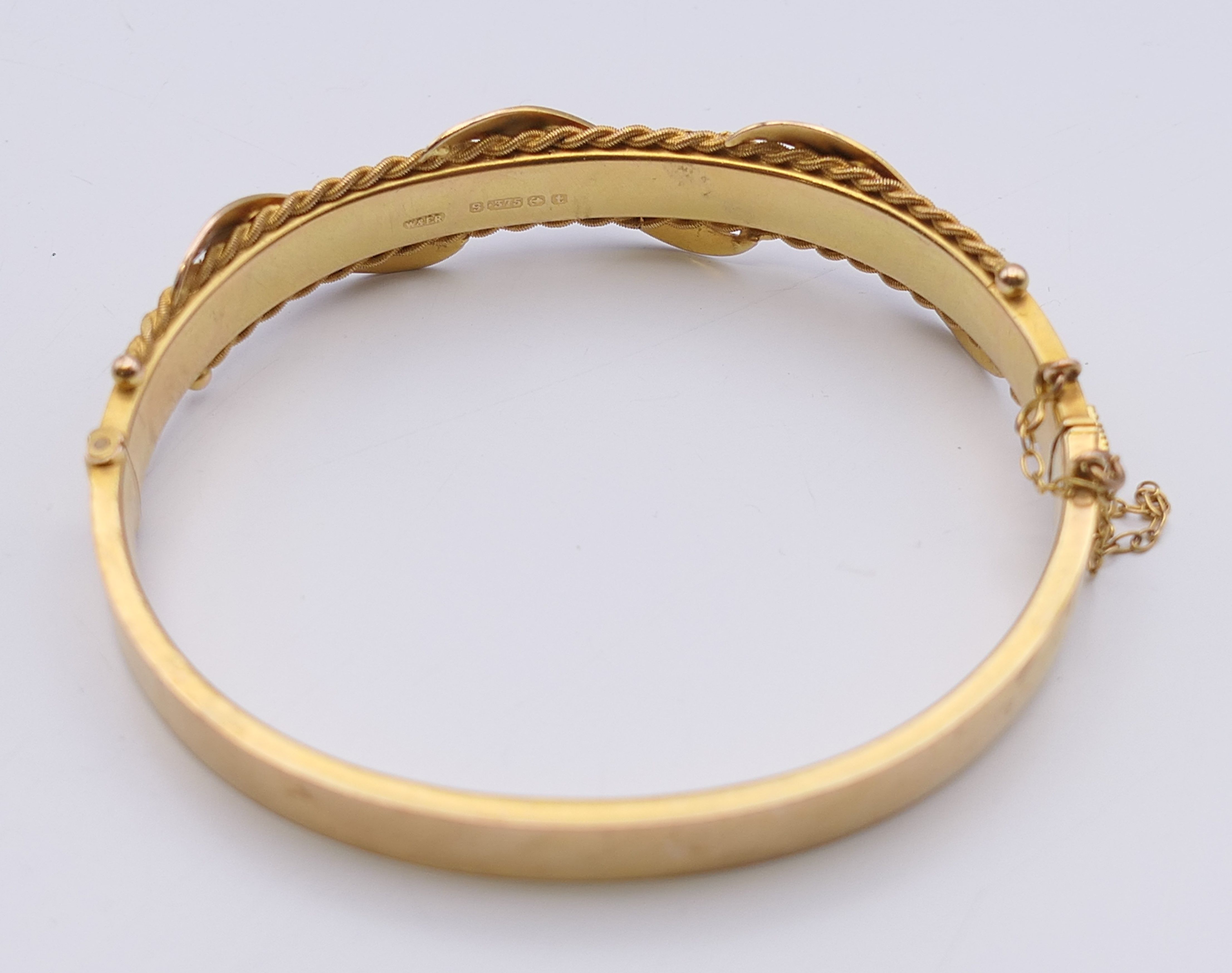 A 9 ct gold diamond and ruby bangle form bracelet. 6 cm internal diameter. 11. - Image 8 of 10