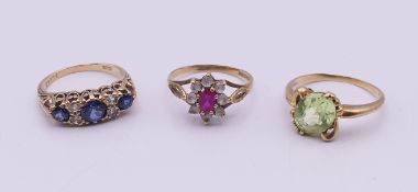 Two 9 ct gold dress rings and a 10 K gold dress ring. 8.2 grammes total weight.