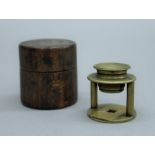 A 19th century brass travelling microscope in wooden case. The case 5 cm high.