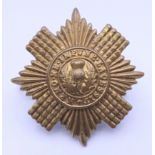 A military cap badge. 4.25 cm diameter.