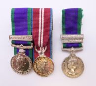 Three miniature medals with bars, two Northern Ireland and a South Arabia. 5.