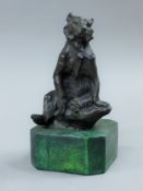 A bronze model of a bear on a plinth base. 16.5 cm high.