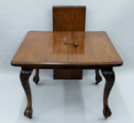 A Victorian mahogany single leaf extending dining table. 140 cm long extended x 102 cm wide.