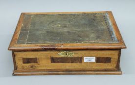 A leather inset writing box. 39 cm wide.